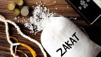 A,Picture,Of,Zakat,Rice,Bag,With,Coins,,Tasbeeh,And Zakat